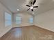 Spacious bedroom featuring light wood floors, recessed lighting, ceiling fan, and natural light at 2620 Poplar Cove Nw Dr, Concord, NC 28027