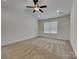 Spacious bedroom featuring neutral carpet, recessed lighting, ceiling fan, and natural light at 2620 Poplar Cove Nw Dr, Concord, NC 28027