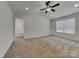 Spacious bedroom featuring neutral carpet, recessed lighting, ceiling fan, and natural light at 2620 Poplar Cove Nw Dr, Concord, NC 28027