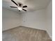 Spacious bedroom featuring neutral carpet, a modern ceiling fan, and white trim at 2620 Poplar Cove Nw Dr, Concord, NC 28027