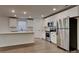 Bright kitchen with stainless steel appliances, an island, and white cabinets at 2620 Poplar Cove Nw Dr, Concord, NC 28027
