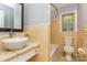 Bathroom showcasing a granite countertop, a vessel sink, a toilet, and a tiled shower at 2631 Ivey Church Rd, Lincolnton, NC 28092