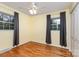 Bedroom features hardwood floors, a ceiling fan, two windows, and a closet at 2631 Ivey Church Rd, Lincolnton, NC 28092