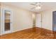Bedroom showcasing hardwood floors, a ceiling fan, and double closets at 2631 Ivey Church Rd, Lincolnton, NC 28092
