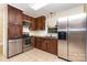 Modern kitchen features stainless steel appliances and dark wood cabinets at 2631 Ivey Church Rd, Lincolnton, NC 28092