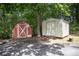 Exterior view of two sheds in a wooded backyard at 2631 Ivey Church Rd, Lincolnton, NC 28092