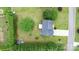 Aerial view of a house with a large, green backyard, surrounded by trees and a shed at 2779 Touchstone Cir, Newton, NC 28658