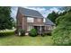Brick home with a covered porch, perfect for enjoying the outdoors in a serene backyard at 2779 Touchstone Cir, Newton, NC 28658