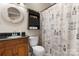Charming bathroom featuring stylish vanity, decorative mirror, and toilet at 2779 Touchstone Cir, Newton, NC 28658