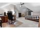 Bright bedroom featuring vaulted ceilings, a ceiling fan, and a functional desk area for work or study at 2779 Touchstone Cir, Newton, NC 28658