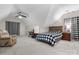 Inviting bedroom featuring vaulted ceilings, carpeted floors, and ample natural light from the windows at 2779 Touchstone Cir, Newton, NC 28658