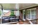 Relaxing covered deck area with comfortable seating and a stylish outdoor rug at 2779 Touchstone Cir, Newton, NC 28658