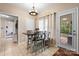 Cozy dining area with a modern chandelier and access to the outdoor space at 2779 Touchstone Cir, Newton, NC 28658