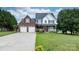 Charming two-story brick home with a well-manicured lawn and two-car garage at 2779 Touchstone Cir, Newton, NC 28658