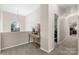 Hallway with chandelier and natural light from arched window feature at 2779 Touchstone Cir, Newton, NC 28658