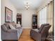 Living room featuring comfortable seating and two built-in shelving units at 2779 Touchstone Cir, Newton, NC 28658