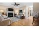 Inviting living room featuring a fireplace, plush seating, and wood floors at 2779 Touchstone Cir, Newton, NC 28658