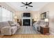 Inviting living room with neutral decor, plush sofas, fireplace, and hardwood floors at 2779 Touchstone Cir, Newton, NC 28658
