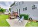 Back patio has table with chairs, and access to a well-maintained backyard at 3725 Leela Palace Way, Fort Mill, SC 29708
