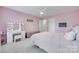 Adorable pink bedroom featuring carpet floors, a vanity table, a queen bed, and a ceiling fan at 3725 Leela Palace Way, Fort Mill, SC 29708
