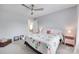Comfortable bedroom with carpet floors, a floral-themed bed, a ceiling fan, and a pink bedside table at 3725 Leela Palace Way, Fort Mill, SC 29708