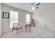 Bright bedroom with carpet floors, two windows, and a ceiling fan at 3725 Leela Palace Way, Fort Mill, SC 29708