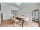 Bright dining room features modern chairs, hardwood floors, and access to other rooms at 3725 Leela Palace Way, Fort Mill, SC 29708