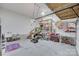 Spacious garage with ample storage shelving, overhead rack, and extra space for a workshop at 3725 Leela Palace Way, Fort Mill, SC 29708