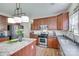 This kitchen features wood floors, cherry cabinets, granite countertops, stainless steel appliances and a kitchen island at 3725 Leela Palace Way, Fort Mill, SC 29708