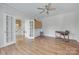 Bright room with hardwood floors and access to the staircase through glass doors at 3725 Leela Palace Way, Fort Mill, SC 29708