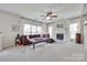 Cozy living room with a fireplace, plush carpet, and plenty of natural light at 3725 Leela Palace Way, Fort Mill, SC 29708