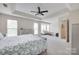 Large main bedroom with trey ceiling, fan, carpet floors, sitting area, and lots of natural light at 3725 Leela Palace Way, Fort Mill, SC 29708