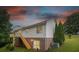 View of the back of the house with a wooden deck and stair access to the yard at 4059 Caitlins Way, Hickory, NC 28602