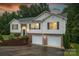 Charming two-story home featuring a brick facade, vinyl siding, and an attached two-car garage at 4059 Caitlins Way, Hickory, NC 28602