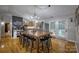 Open-concept kitchen and dining area with a large wooden table and stainless steel appliances at 4059 Caitlins Way, Hickory, NC 28602