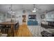Spacious living area open to dining room features hardwood floors, a ceiling fan, and comfortable furnishings at 4059 Caitlins Way, Hickory, NC 28602