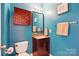 The bathroom features a vanity with storage, a granite countertop, and a framed mirror at 415 Glandon Ct, Fort Mill, SC 29708