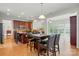 Open kitchen featuring granite countertops, stainless steel appliances, a dining table, and an open concept floorplan at 415 Glandon Ct, Fort Mill, SC 29708