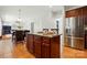 Kitchen island with seating and stainless steel appliances at 415 Glandon Ct, Fort Mill, SC 29708