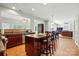 Open kitchen featuring granite counters, an island with seating, stainless steel appliances, and an open layout at 415 Glandon Ct, Fort Mill, SC 29708