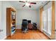 Bright office with hardwood floors, built in bookshelf, and ceiling fan at 415 Glandon Ct, Fort Mill, SC 29708