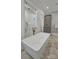 Bathroom featuring modern tub and shower design and stylish tile flooring at 4211 Tangle Dr, Charlotte, NC 28211