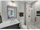 Beautifully appointed bathroom with glass shower and black and white hexagon tile at 4211 Tangle Dr, Charlotte, NC 28211