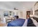 Bedroom with a large bed, work desk, and natural light from the windows at 4211 Tangle Dr, Charlotte, NC 28211
