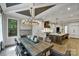 Elegant dining room with stylish lighting and seating for eight at 4211 Tangle Dr, Charlotte, NC 28211