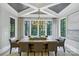 Elegant dining room features large windows and a spacious table perfect for hosting gatherings and creating lasting memories at 4211 Tangle Dr, Charlotte, NC 28211