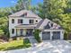 Inviting two-story home with modern farmhouse design and a well-maintained lawn at 4211 Tangle Dr, Charlotte, NC 28211