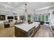 Spacious kitchen with island flows into living room and dining area at 4211 Tangle Dr, Charlotte, NC 28211