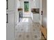 Well-lit laundry room with stylish tiled flooring, modern appliances, and ample storage at 4211 Tangle Dr, Charlotte, NC 28211