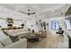 Open-concept living room flowing into a kitchen with recessed lighting and modern furnishings at 4211 Tangle Dr, Charlotte, NC 28211